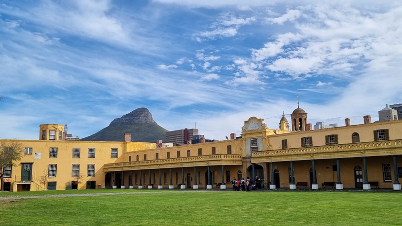 The yellow Castle walls with Lion&rsquo;s Head behind