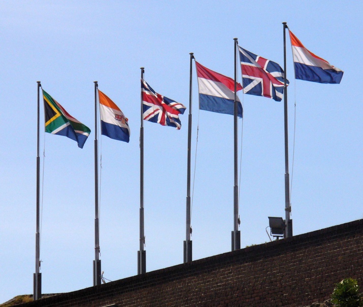 Six historical flags flying above the Castle